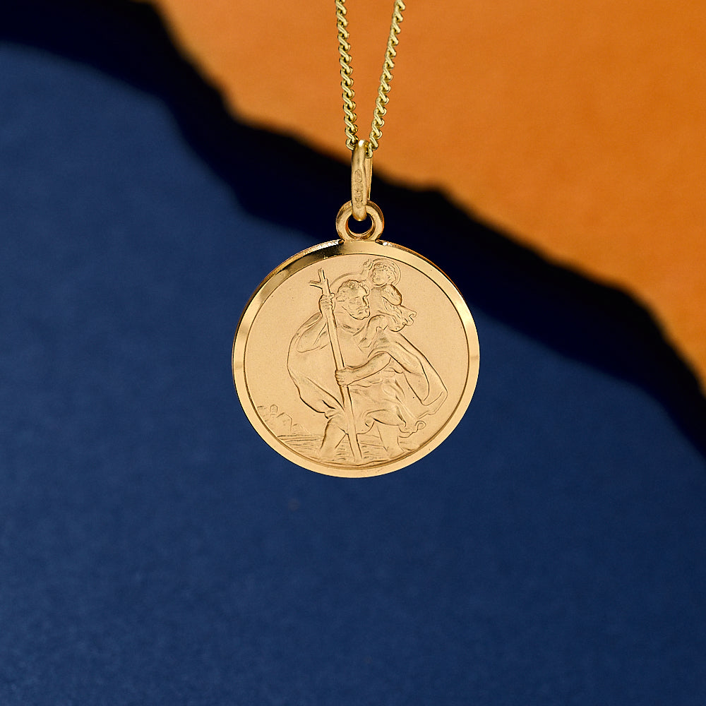 Solid Gold pendant necklace with a Saint Christopher design 20mm wide on light curb chain