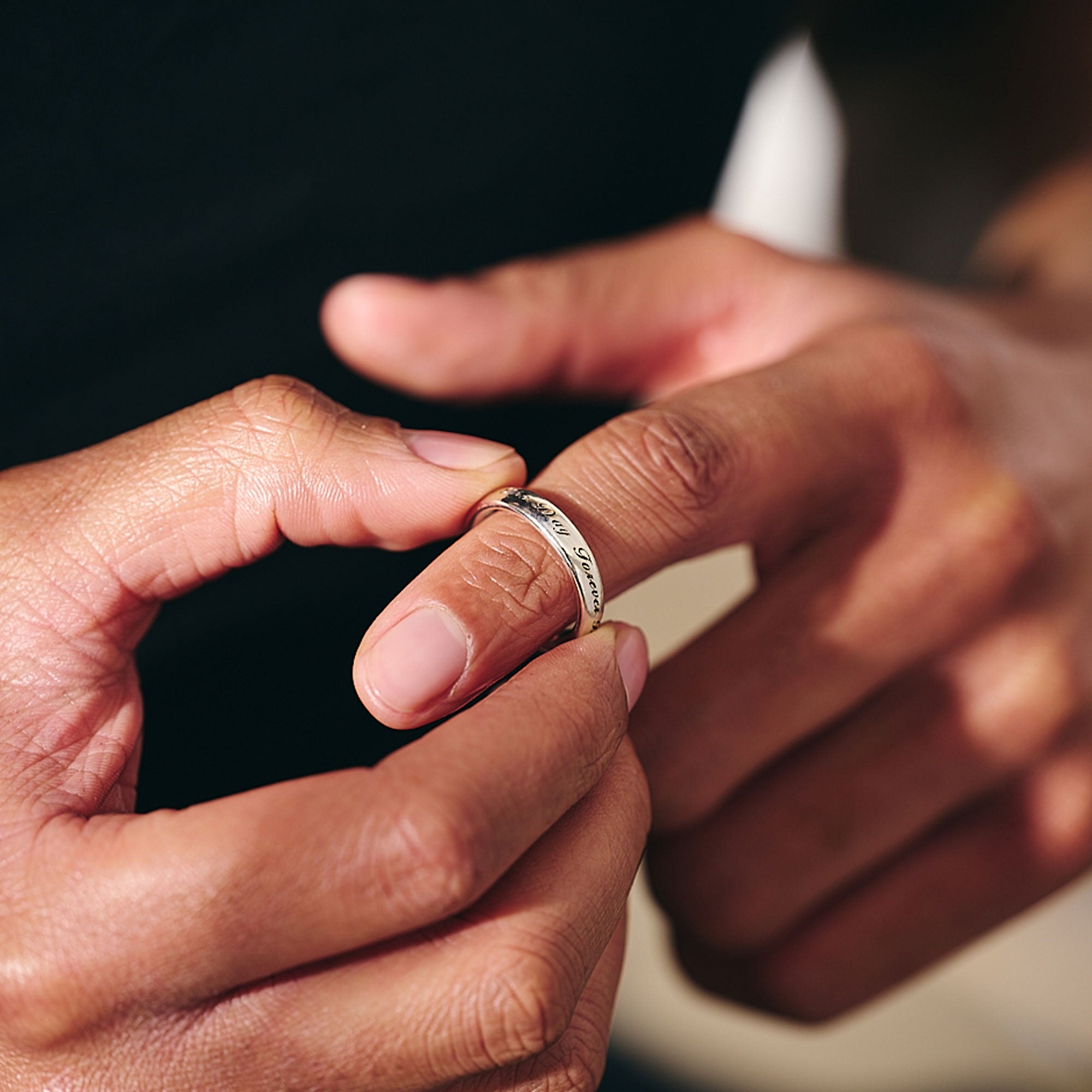personalised silver band ring with engraving around it for him