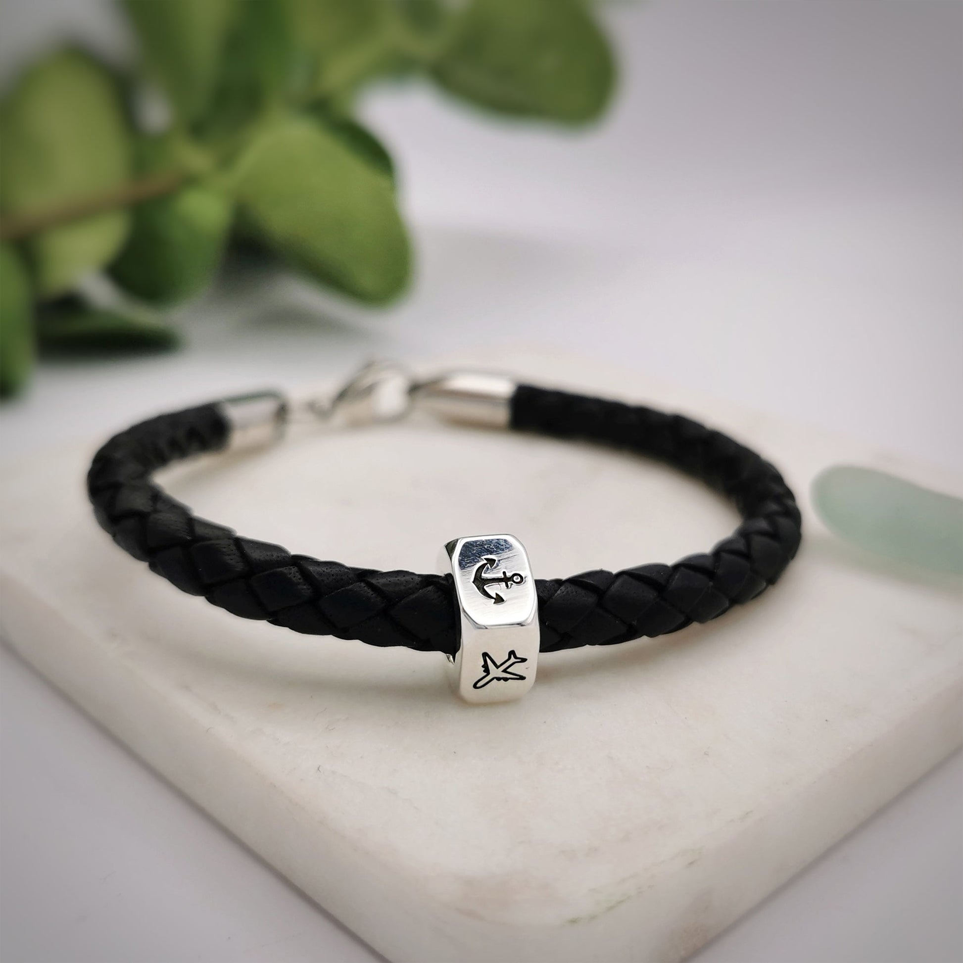 traveller charm bracelet with anchor and aeroplane engraved