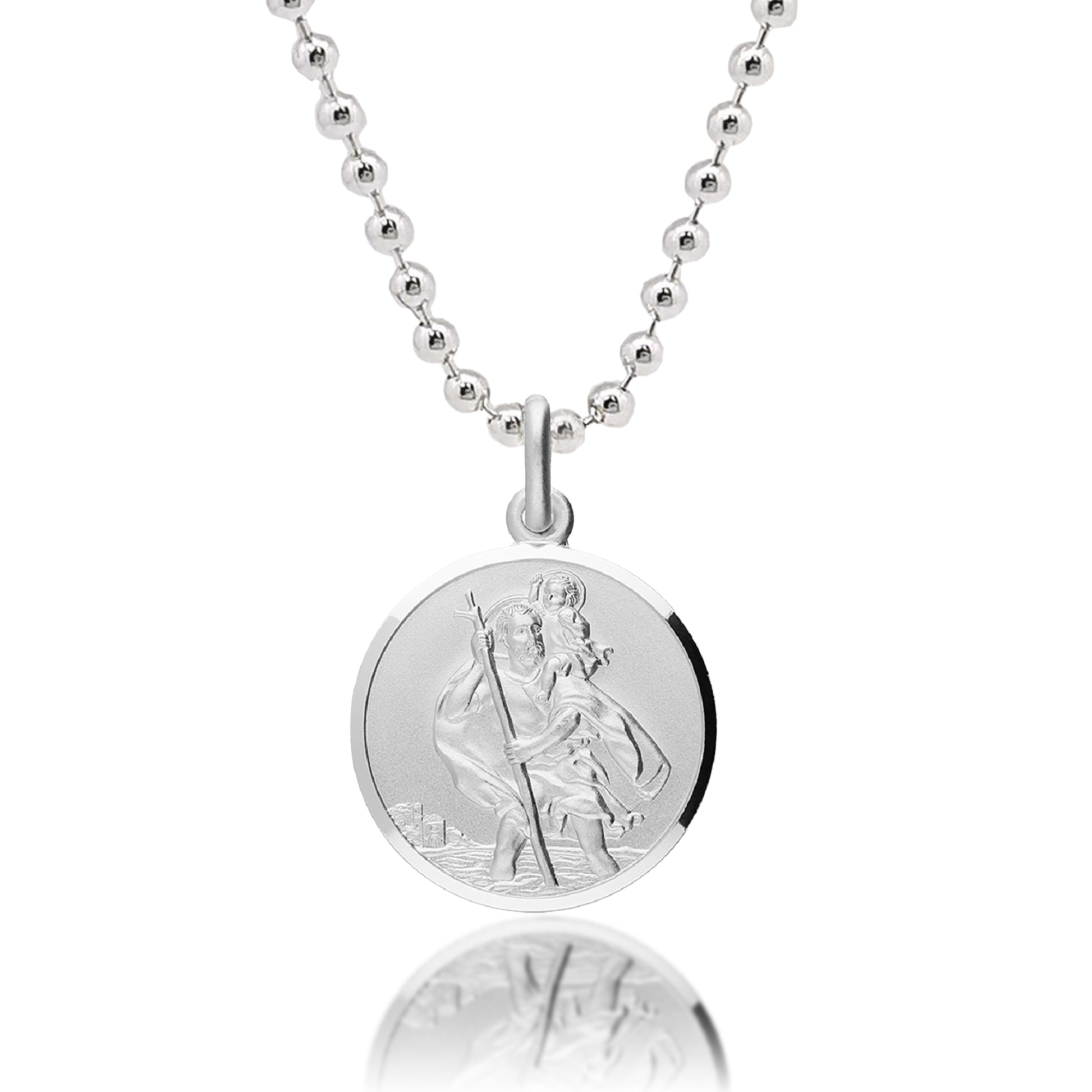 Silver necklace with a round pendant featuring an engraved design on a white background