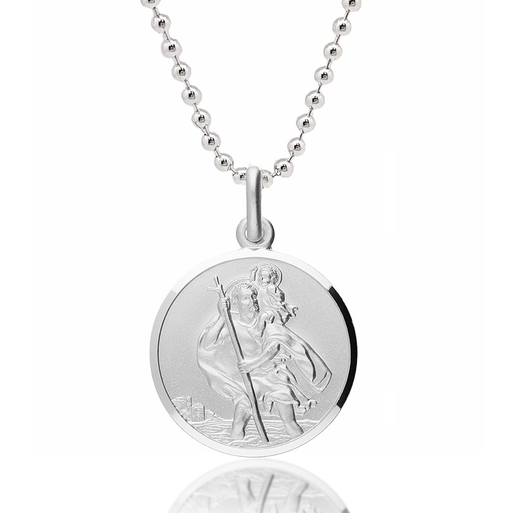 Silver necklace with a round pendant featuring an engraved design on a white background