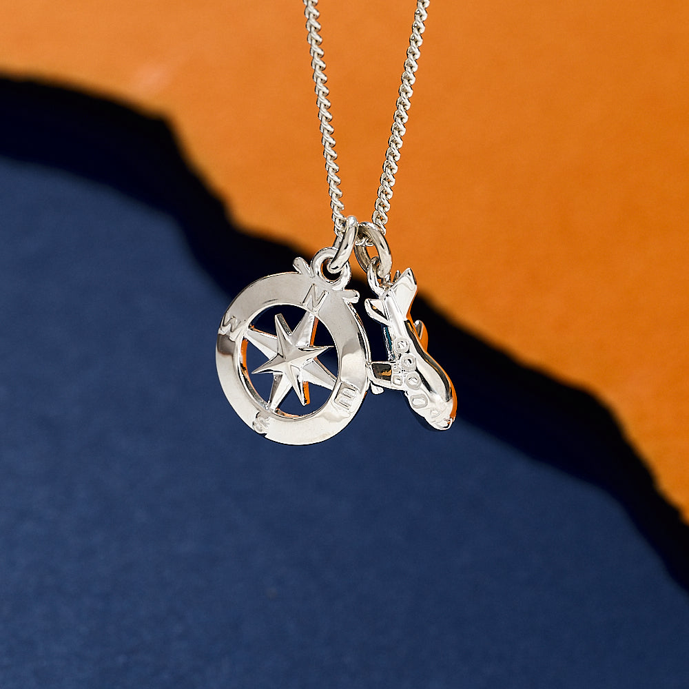 Silver necklace aeroplane and compass 