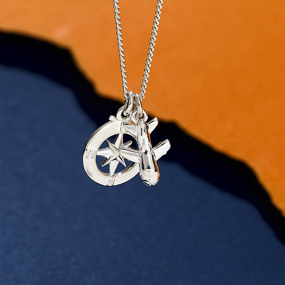 Silver necklace aeroplane and compass off the map travel jewelry