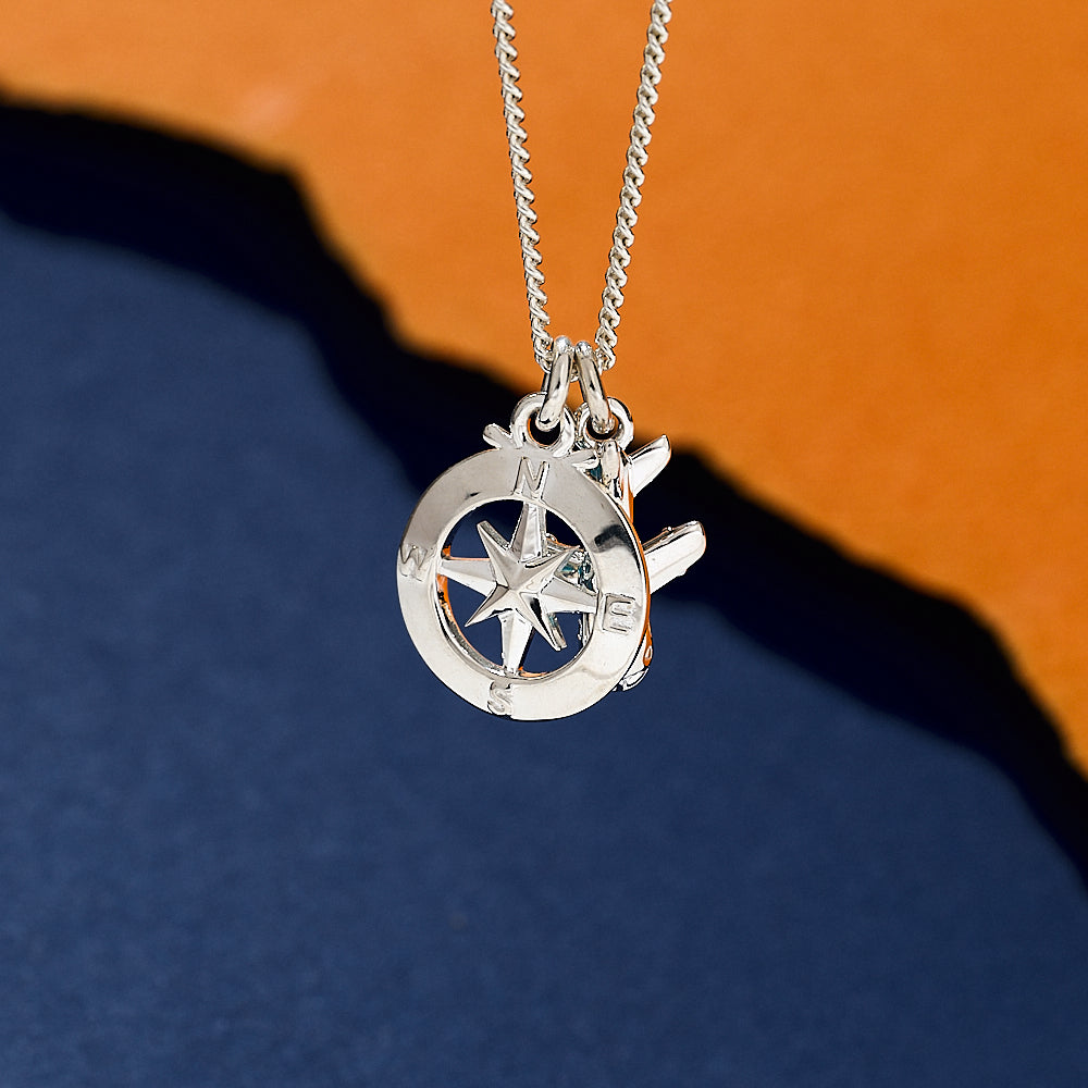 Silver necklace aeroplane and compass 
