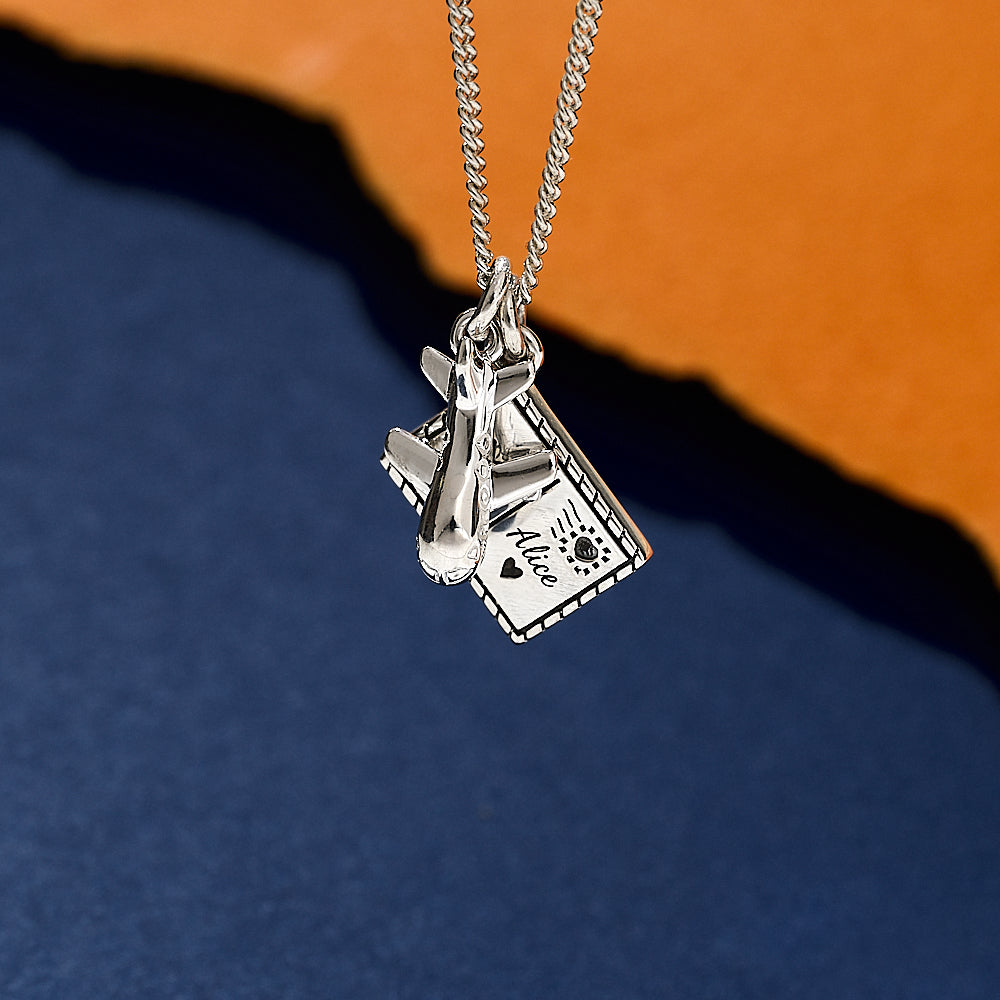 Silver necklace with aeroplane and engraved postcard pendants travel jewellery from off the map