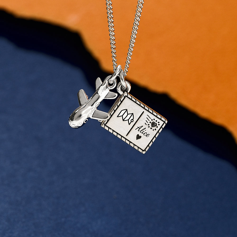 Silver necklace with aeroplane and engraved postcard pendants travel jewellery from off the map