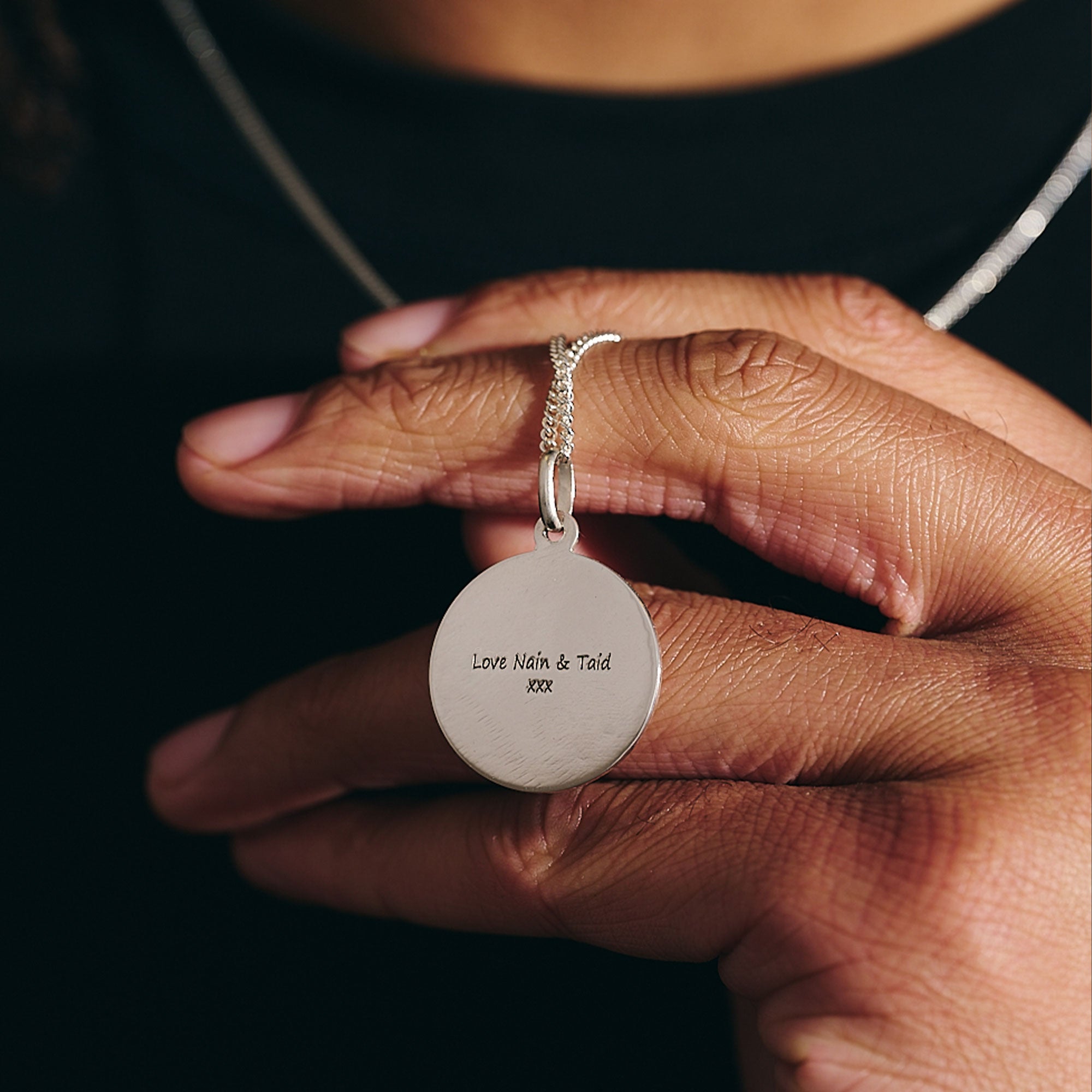 engraved message on back of silver st christopher