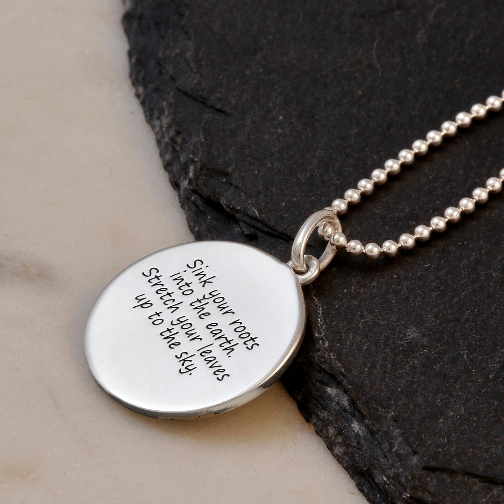 engraved message on back of silver tree of life pendant on silver ball chain necklace