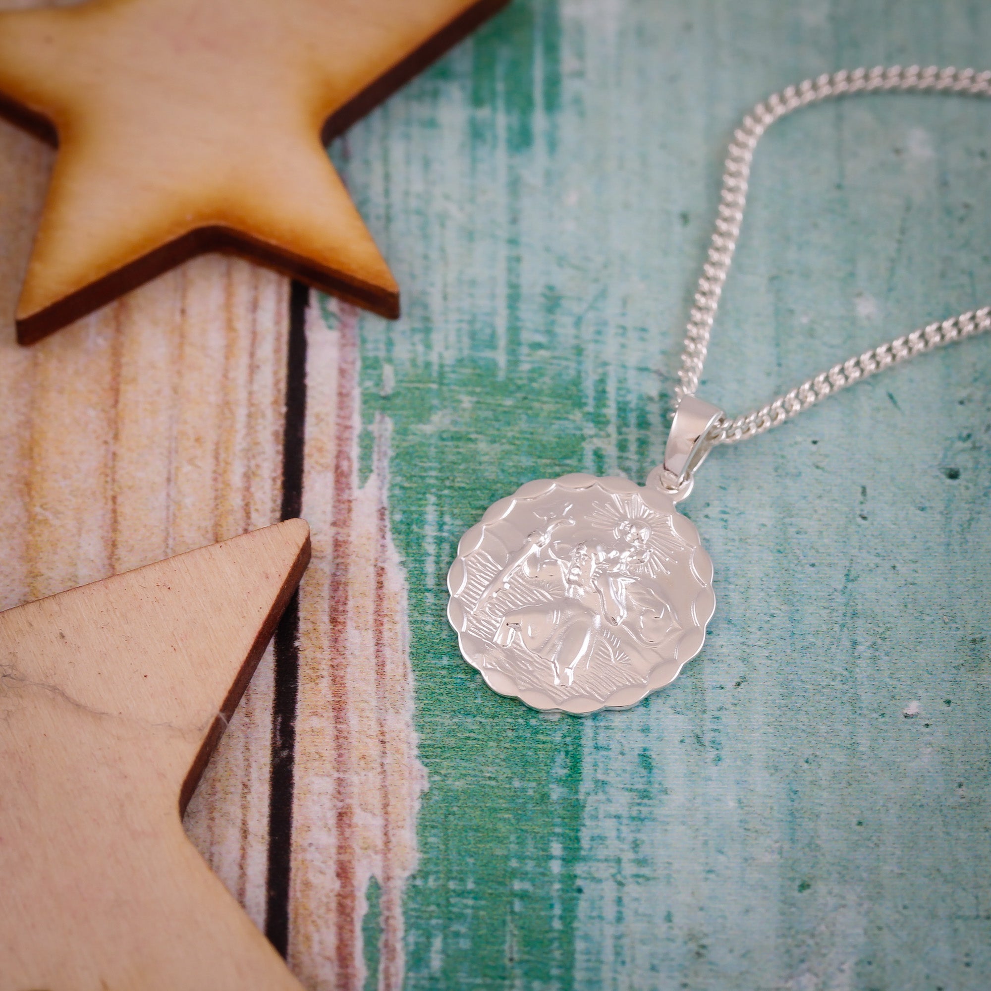 silver ellipse scalloped edge Saint Christopher necklace on heavier curb chain