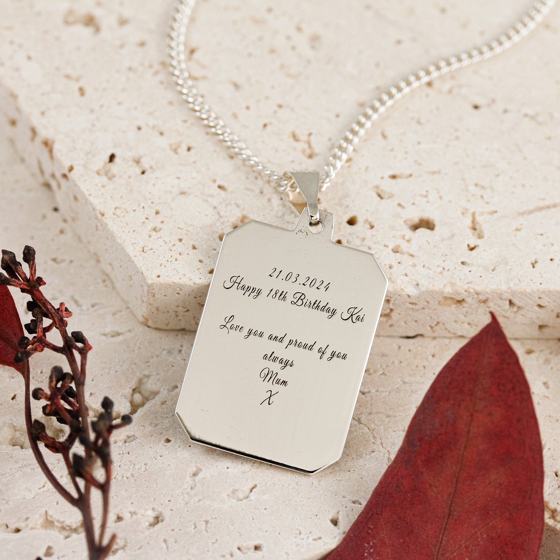 engraved back of silver dog tag saint christopher necklace on heavier curb chain