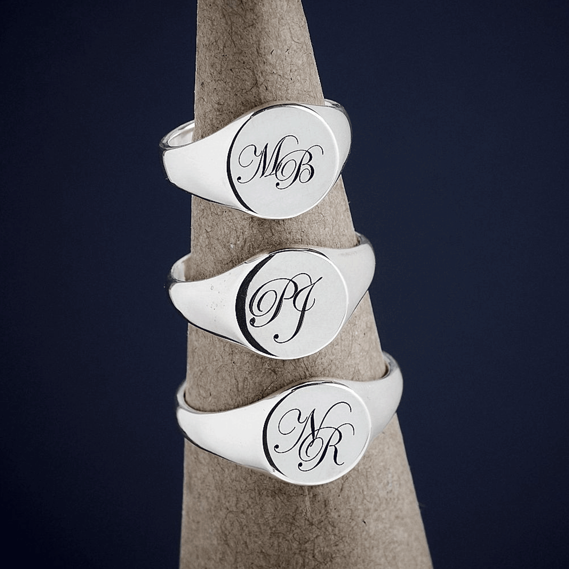 silver signet rings with script monogram initials in different sizes and initials