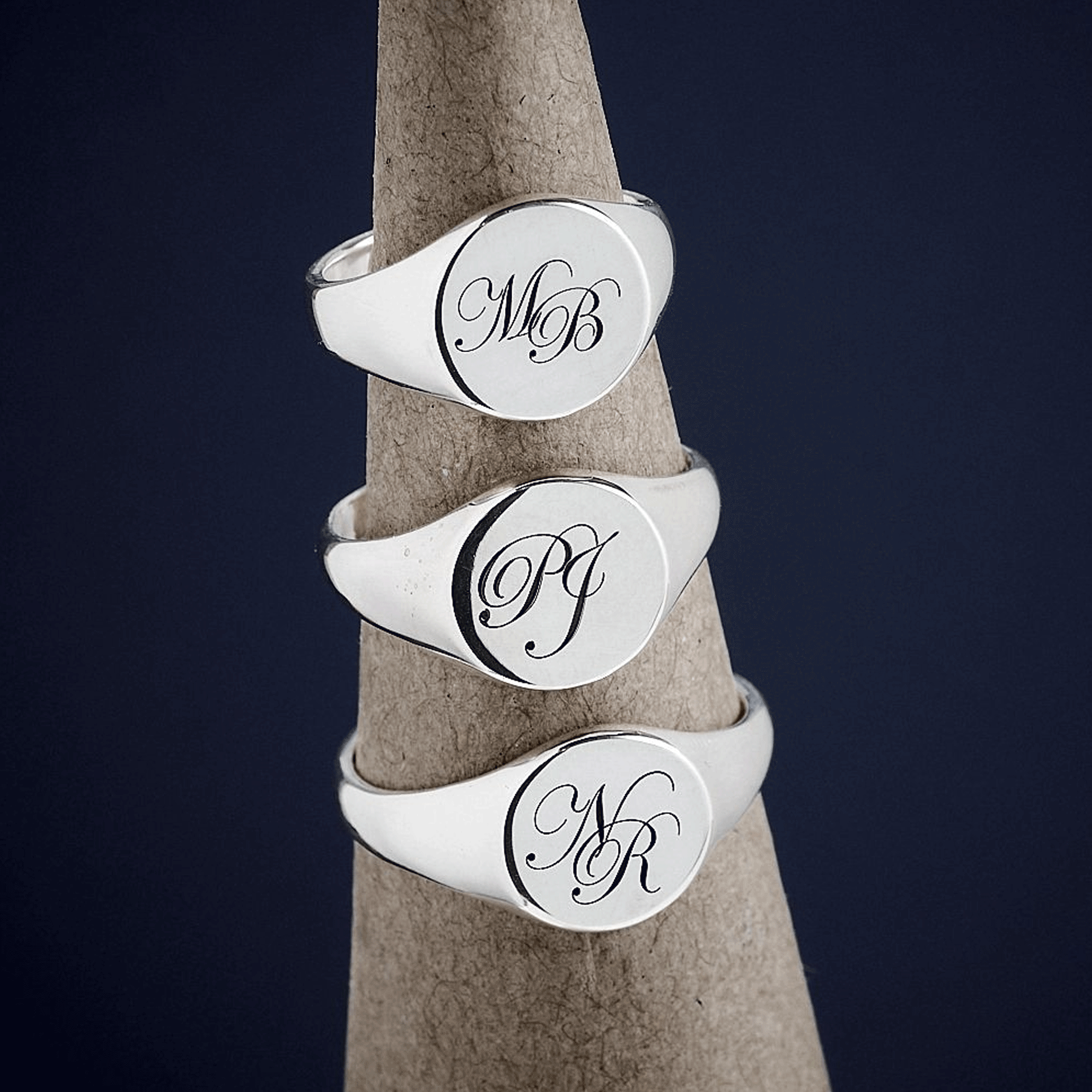 silver signet rings with script monogram initials in different sizes and initials