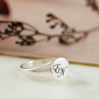 script initials overlapping signet ring engraved EN