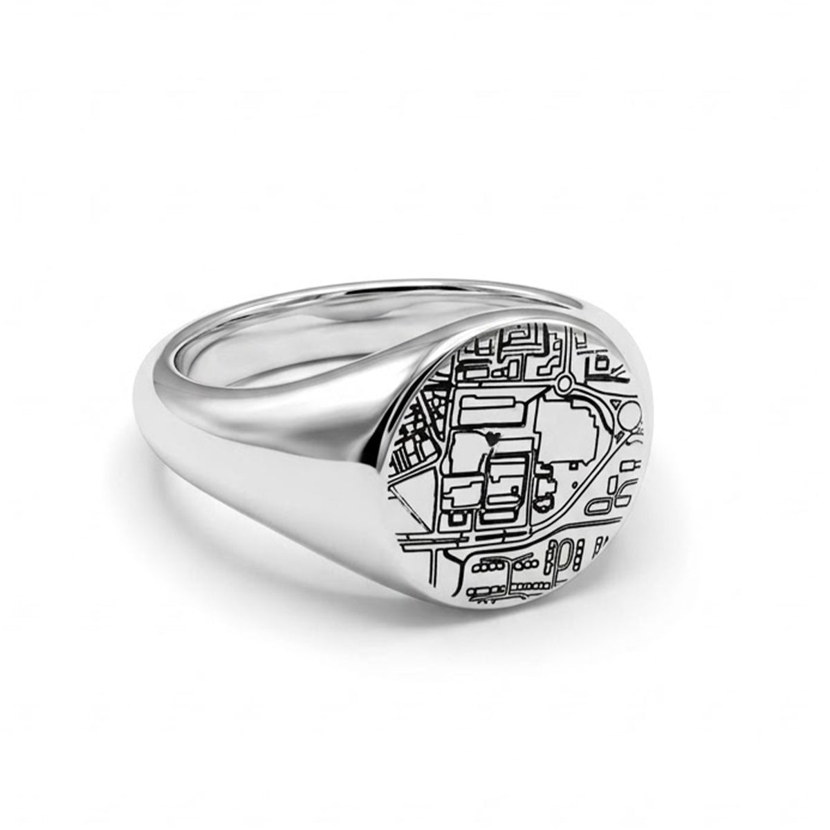 A silver signet ring featuring an engraved map design on its oval face, shown on a clean white background.