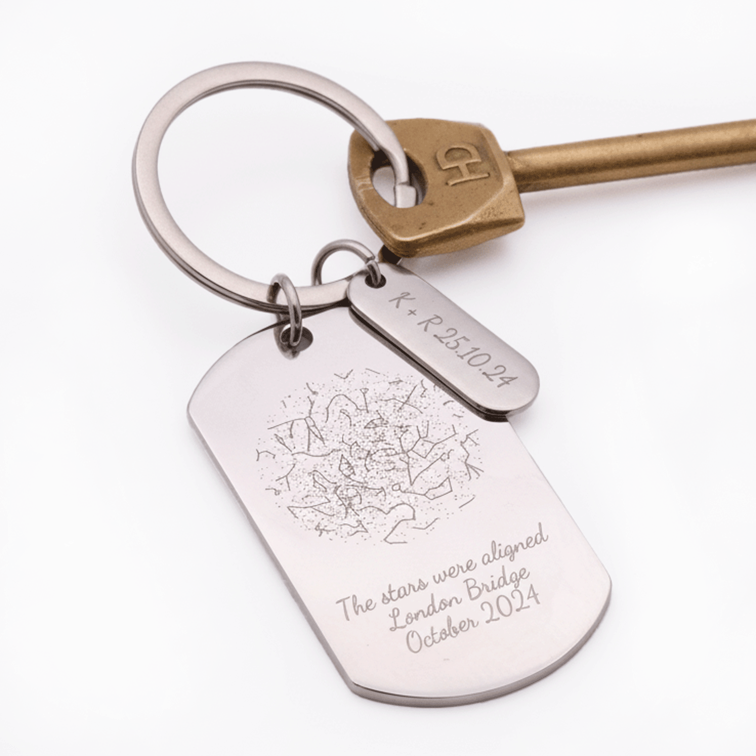 Keychain with engraved star map tag on a white background