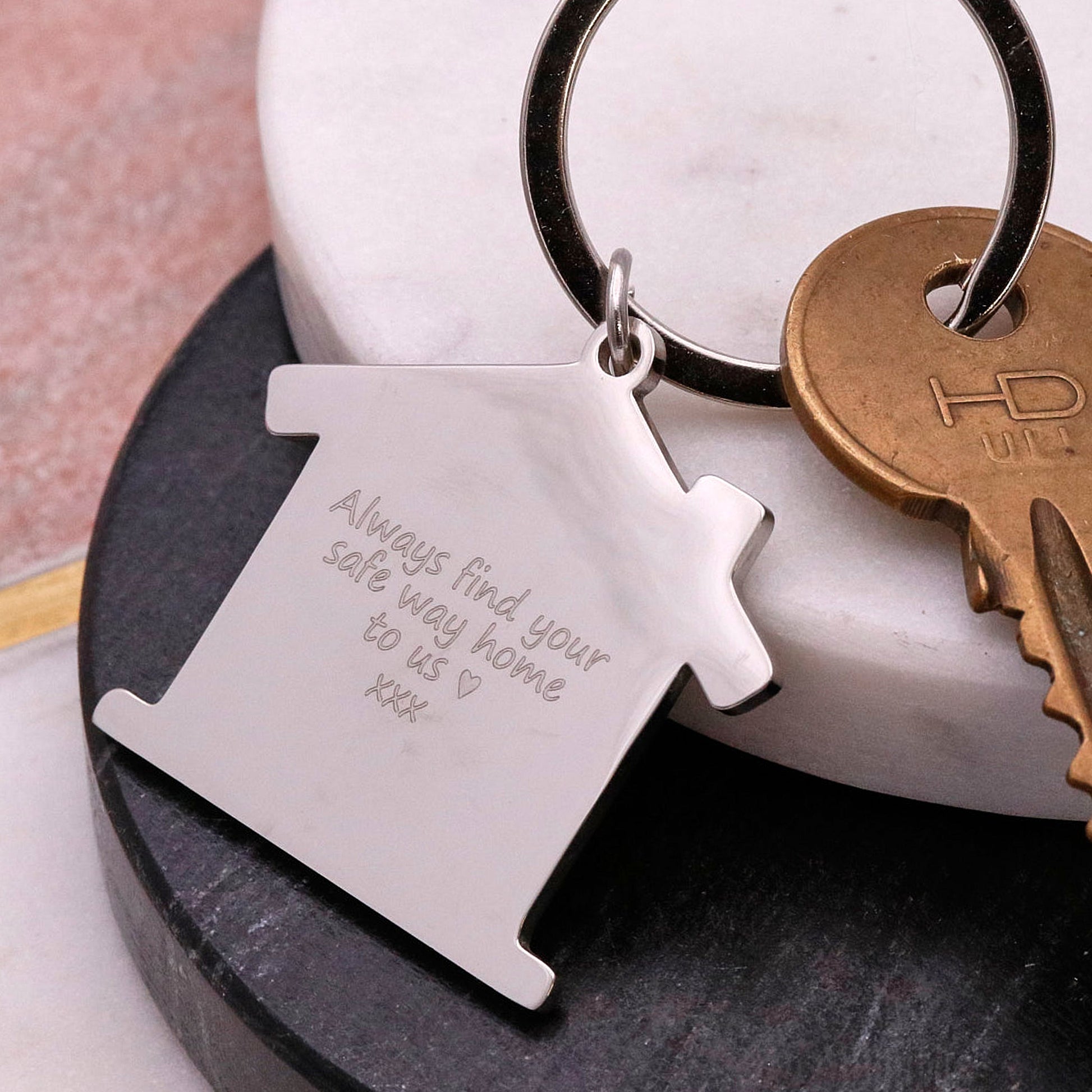 Silver house shaped silver keyring with engraved back