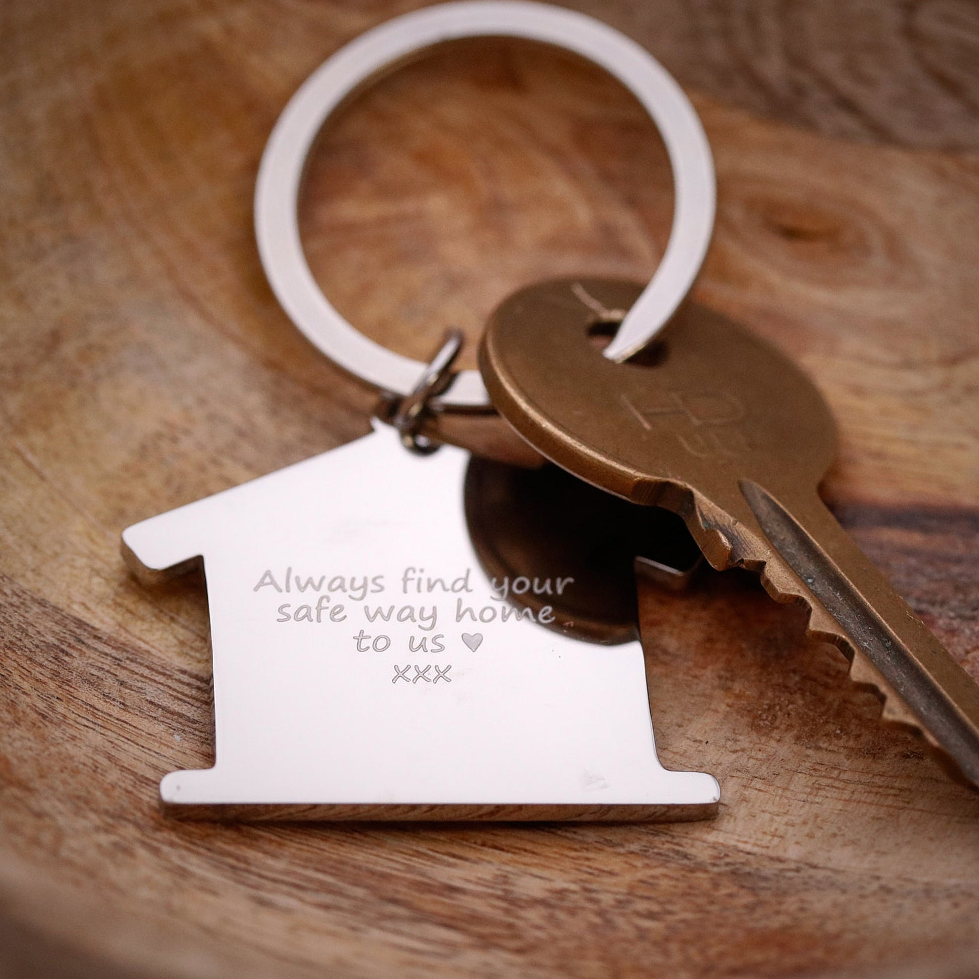Silver house shaped silver keyring with engraving