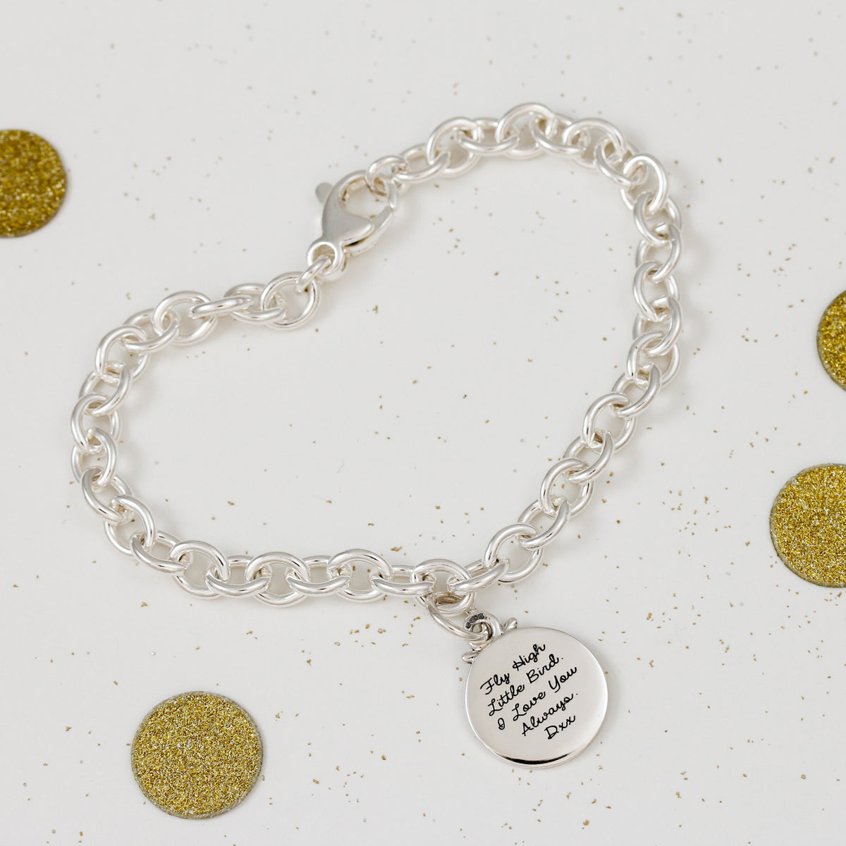 silver compass charm bracelet with engraving on the back