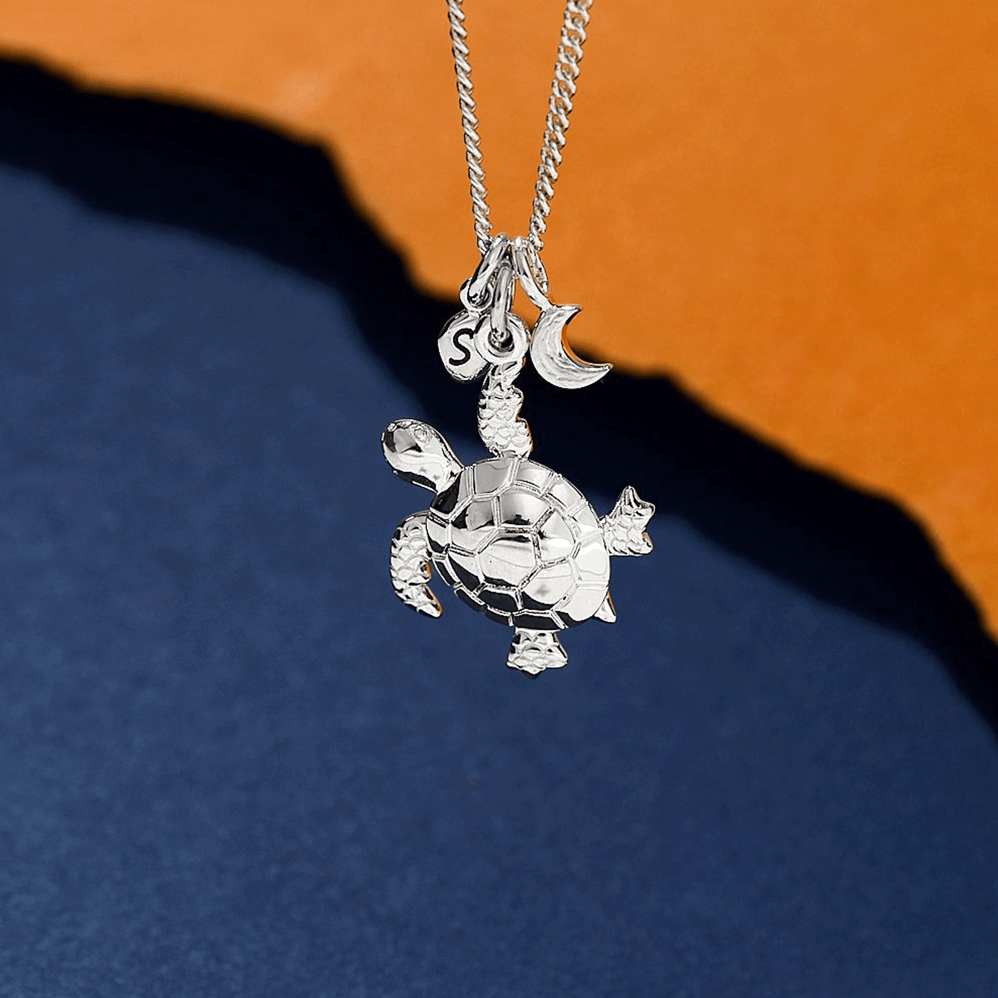 Silver turtle pendant necklace with moon and personalised pebble off the map jewellery