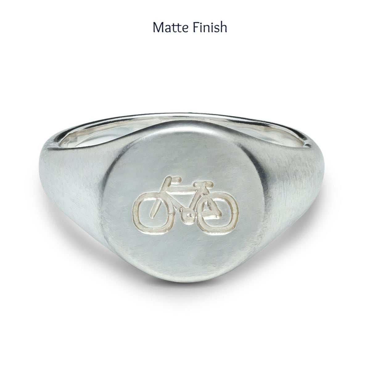matte finish mans silver signet ring engraved with bike symbol from off the map jewellery