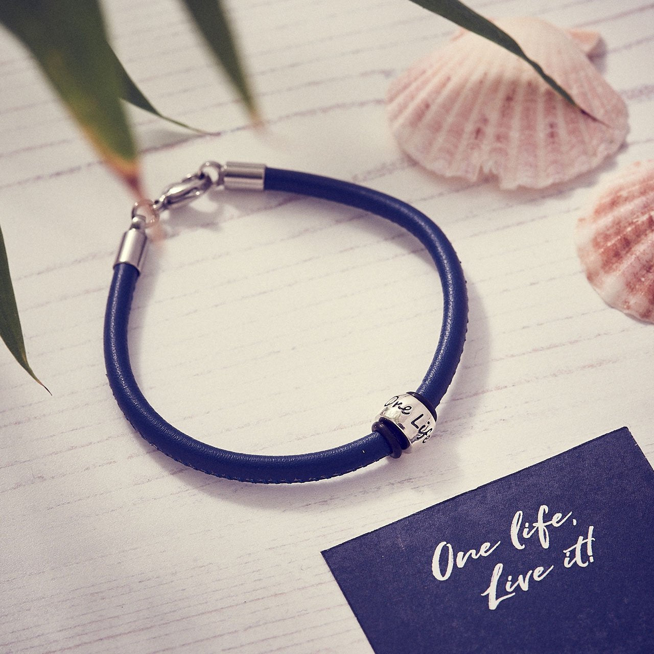 Blue leather & Silver bead charm bracelet engraved One Life Live It for adventurers from Off The Map Brighton