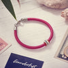 mens or womens red leather bracelet with silver wanderlust travel bead