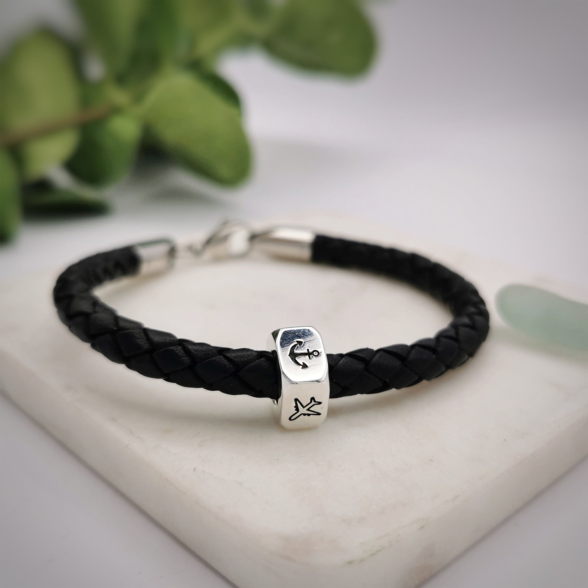 traveller charm bracelet with anchor and aeroplane engraved