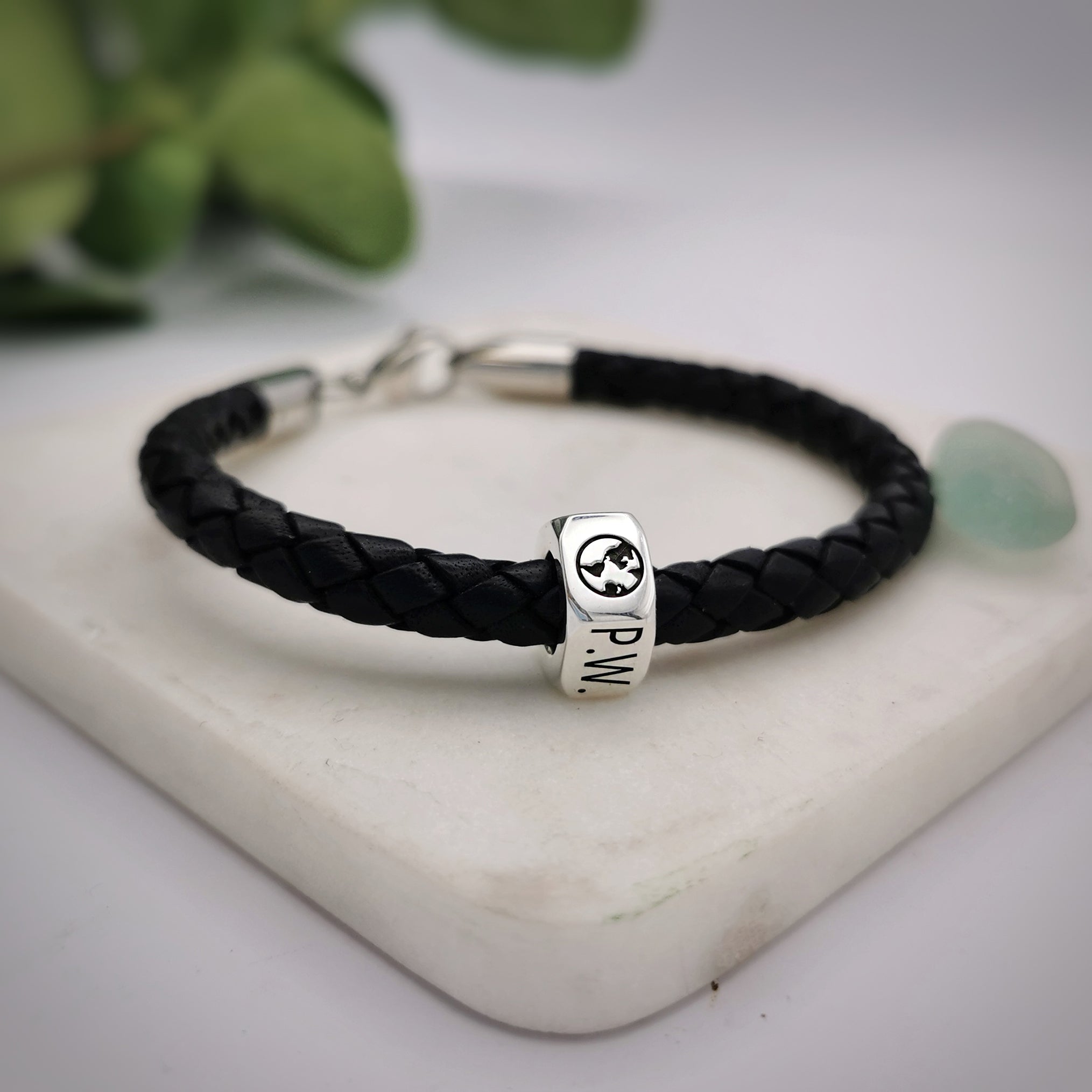 traveller charm bracelet with globe and initials engraved